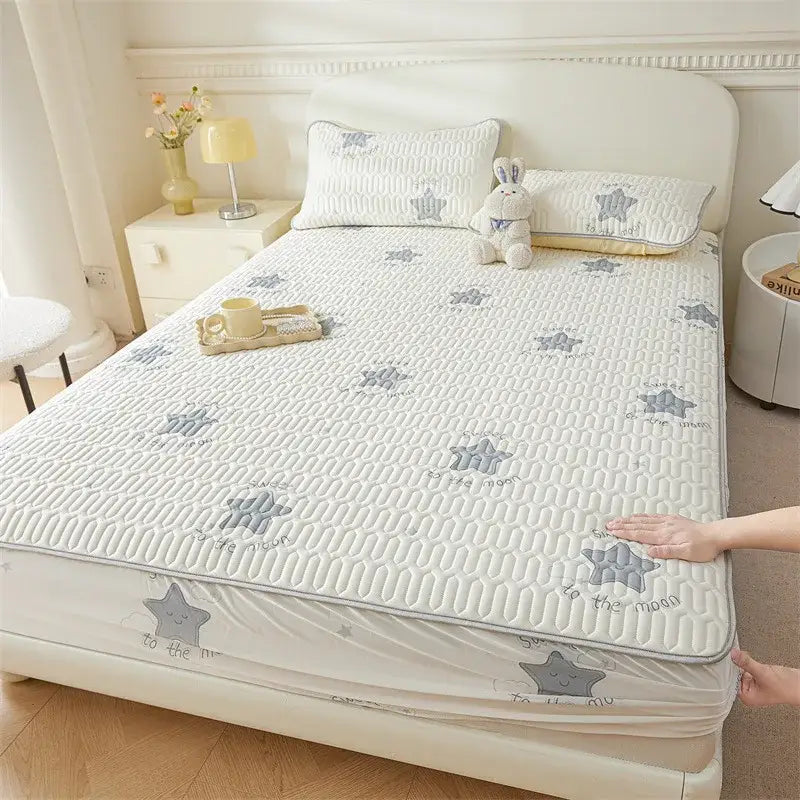 White quilted mattress pad with gray star cute cartoon pattern and to the moon embroidery for fitted sheet cooling use