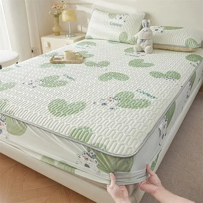 White quilted fitted sheet with cute cartoon pattern of green hearts and cows featuring cooling soft texture