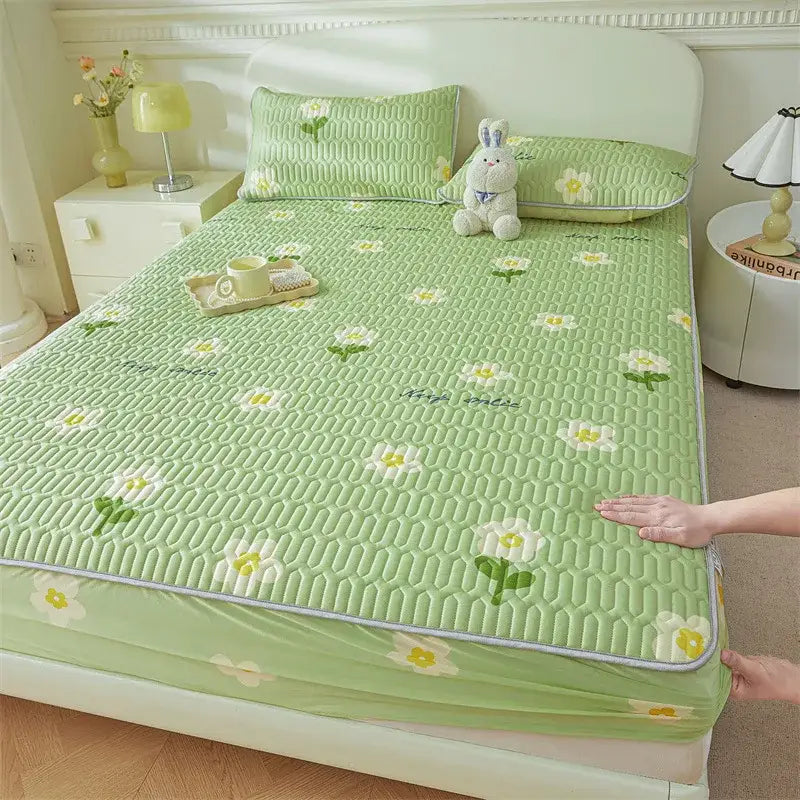 Light green quilted fitted sheet with cute white and yellow daisy cartoon pattern cooling for bedroom use