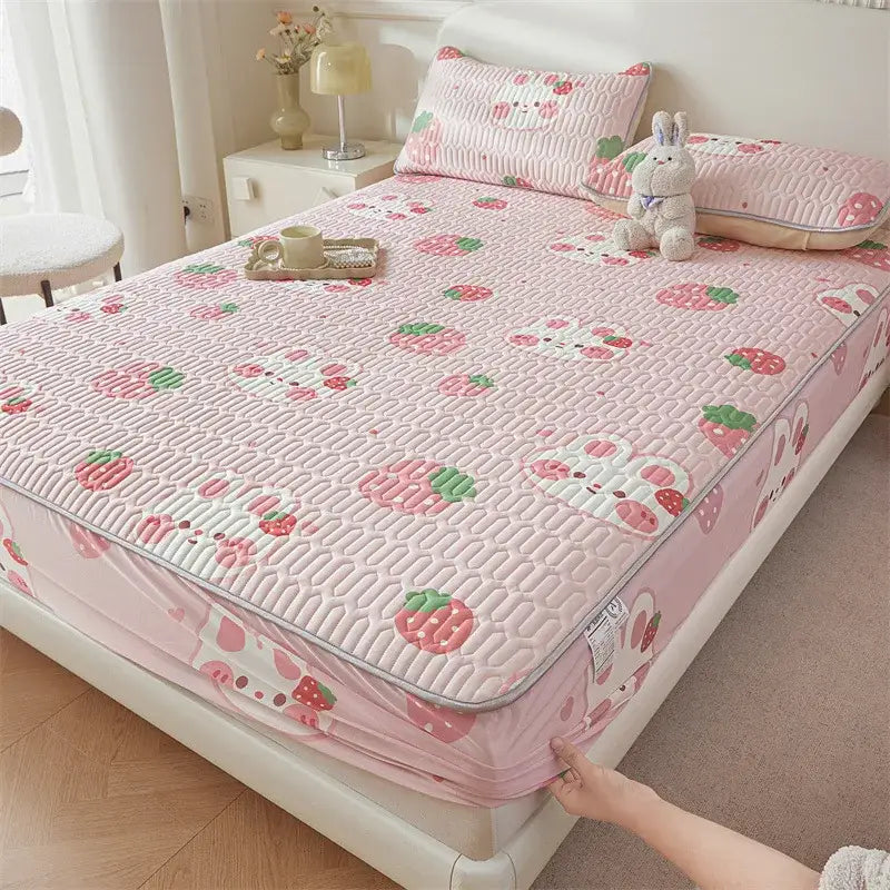 Pink quilted fitted sheet with cute strawberry and bunny cartoon pattern cooling soft fabric and stitched detailing