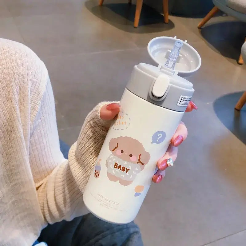 White insulated stainless steel straw cup vacuum flask with gray lid and cartoon dog design featuring the word baby