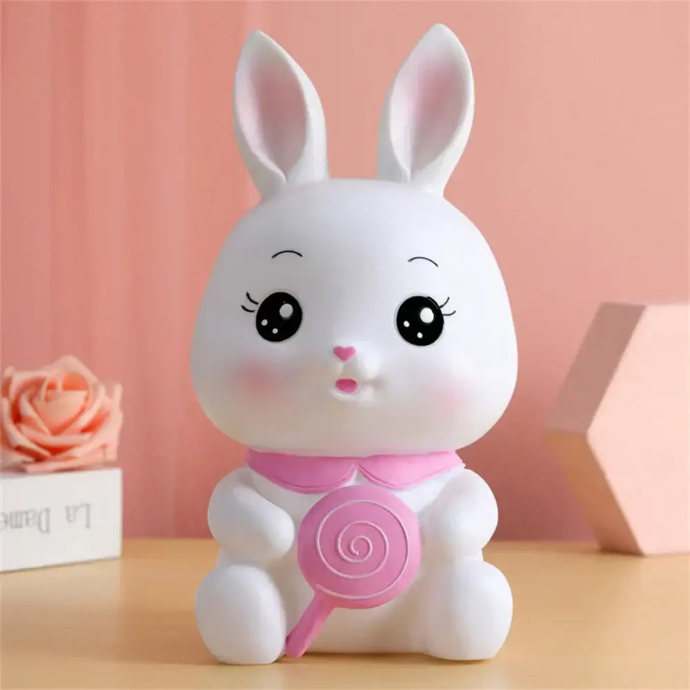 Cute white ceramic bunny piggy bank with pink bow holding lollipop money box for kids bedroom decorbites bunny piggy