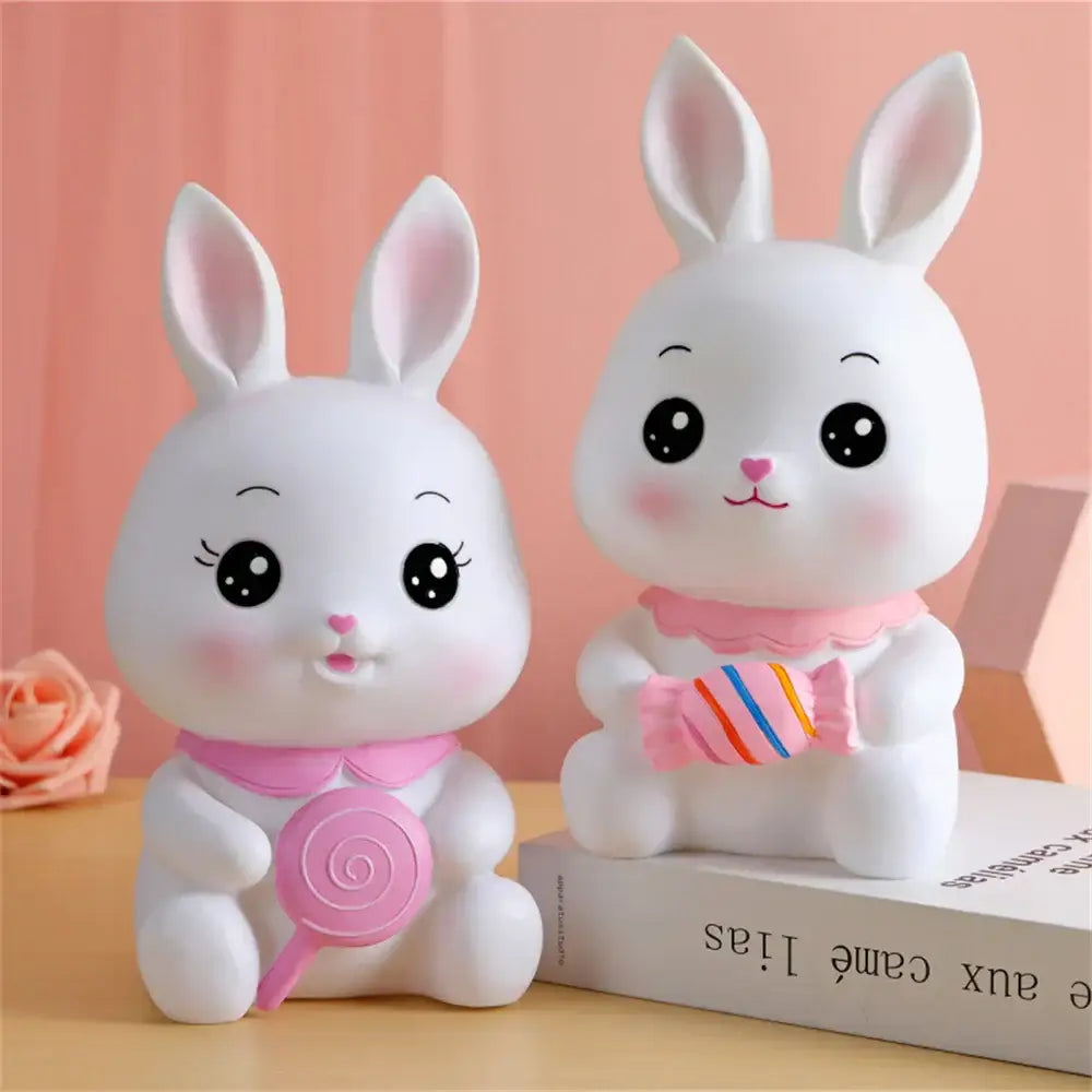 Two adorable white ceramic bunny piggy banks with pink accents and candy accessories for kids bedroom money box decorbites bunny piggy