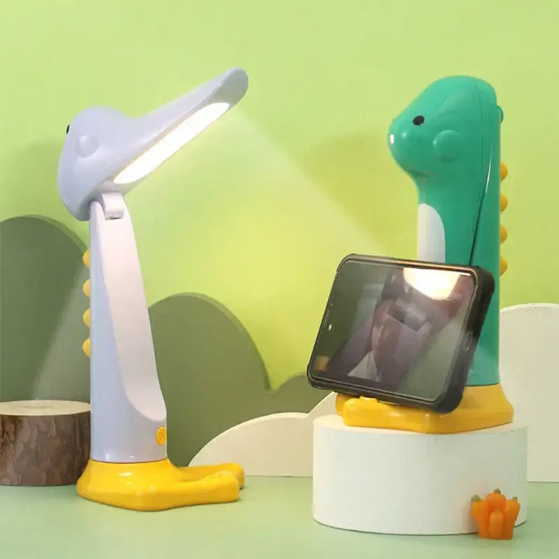 A cute dinosaur led white and yellow desk lamp with a flexible neck designed as a dinosaur led night light