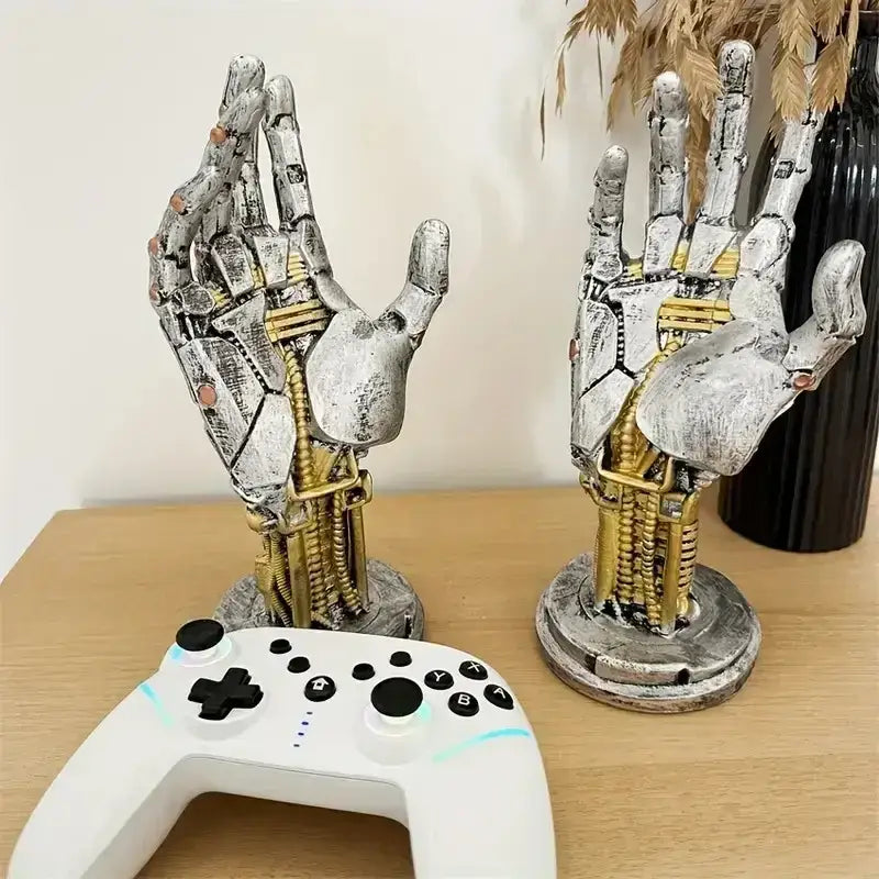 Two metallic silver and gold weathered mechanical arm sculptures with intricate detailing for decorbites cyberpunk desktop stand decor