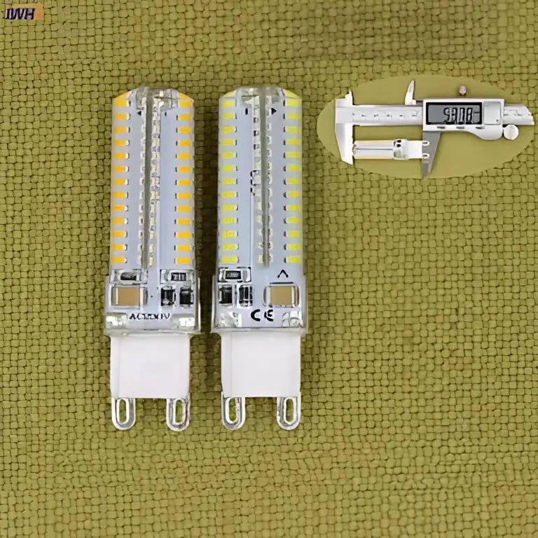 Two cylindrical white decorbites 3w led g9 bulbs with clear glass and metallic base ideal for kitchen lighting