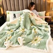 Soft mint green cozy milk velvet blanket with embroidered daisy patterns and fluffy white border for bedroom warmth