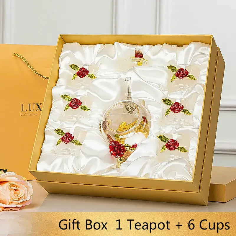 Daisy enamel pink crystal glass teapot set featuring clear glass teapot with gold accents and red rose in satin gift box