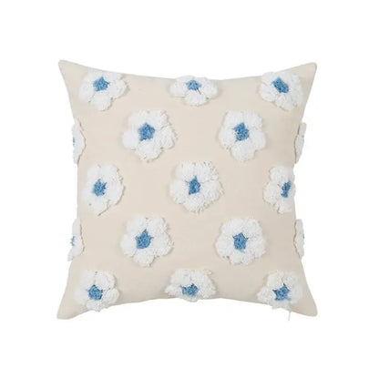 Beige cushion cover with white and blue textured floral appliqués in decorbites daisy flora embroidered style for living room decor