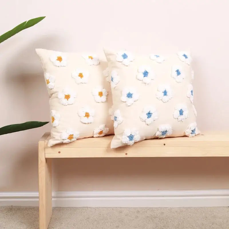 Cream-colored cushion cover with daisy flora embroidered 3D daisies featuring yellow and blue centers for decorbites decor