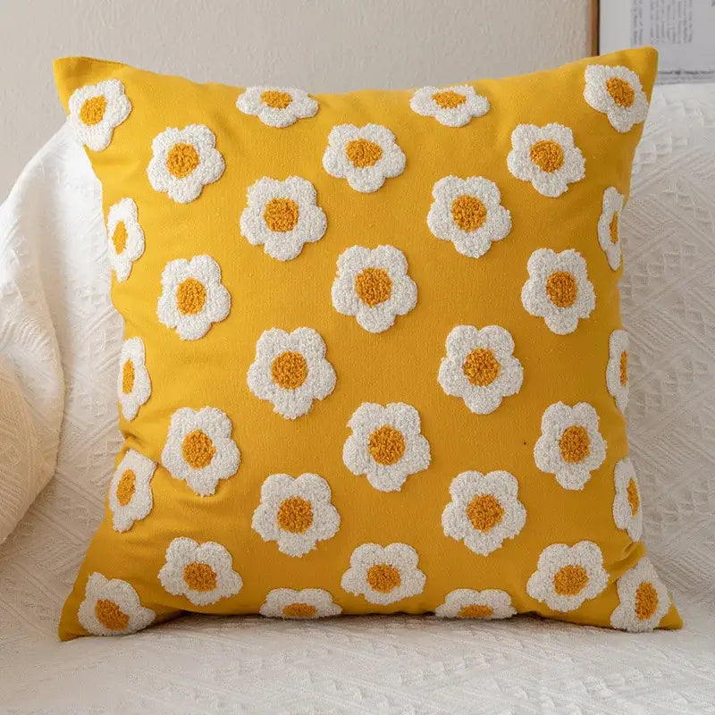 Bright yellow cushion cover with raised white and orange embroidered daisies decorbites daisy flora living room decor