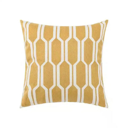A mustard-yellow square cushion with white hexagon pattern pillow cover for decorbites daisy home floral bedroom decor