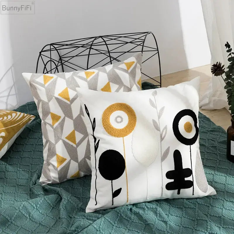 White pillow cover with black and gold embroidered abstract floral design for decorbites daisy home bedroom decor