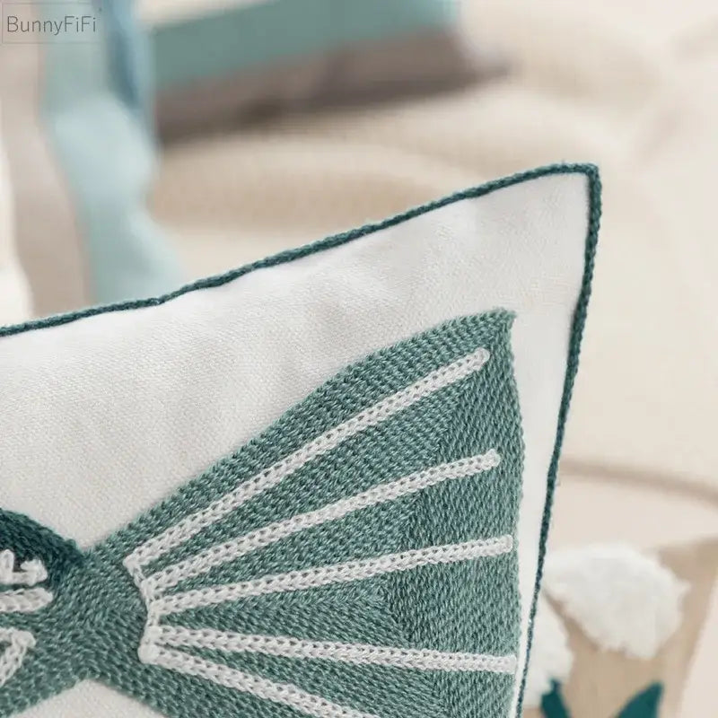 White cushion pillow cover with teal embroidered butterfly and contrasting stitching for decorbites daisy home decor