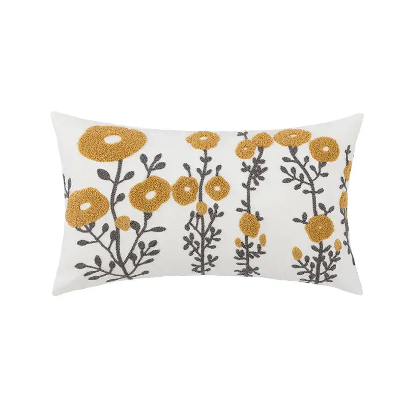 White rectangular pillowcase with geometric embroidery of mustard-yellow daisy floral and dark gray stems for decorbites living room decor