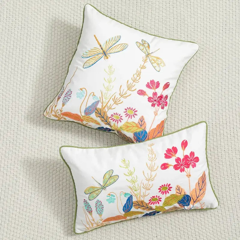 White embroidered cushion cover with colorful dragonflies, floral patterns, olive green piping, decorbites daisy floral green leaves