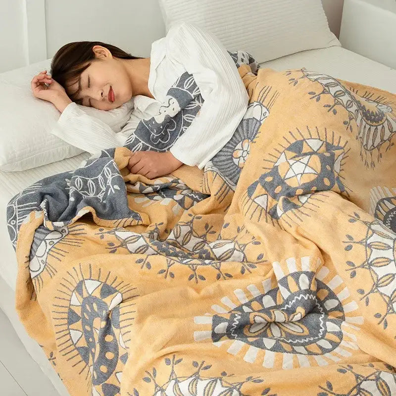 Soft yellow and gray patterned fleece double cotton blanket with intricate floral and geometric designs for bedroom use