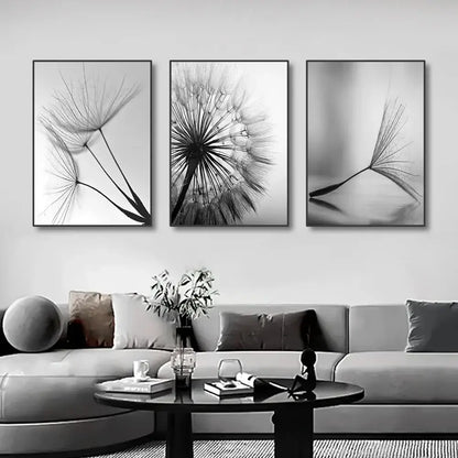 Three black-and-white framed dandelion flower pictures as white dandelion canvas wall art by DecorBites™