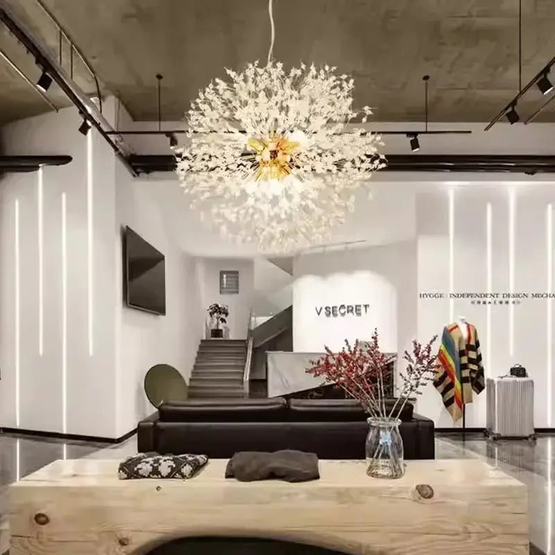 A delicate white dandelion gold chrome chandelier with a golden center hanging in a dining room by decorbites dandelion gold
