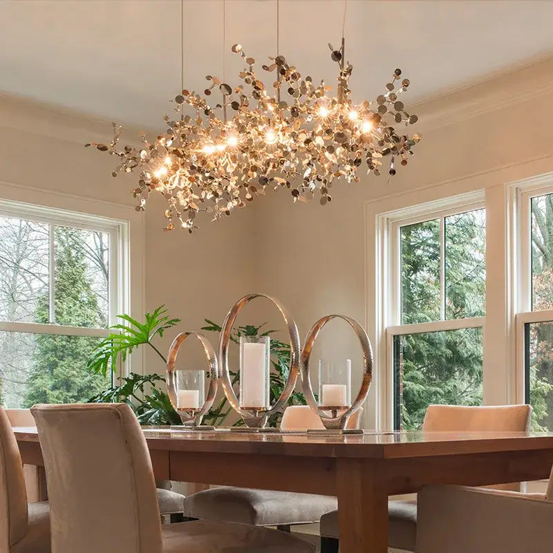 Golden leaf led chandelier with chrome leaf led design featuring intricate metalwork and warm glowing lights for dining room decorbites chrome leaf