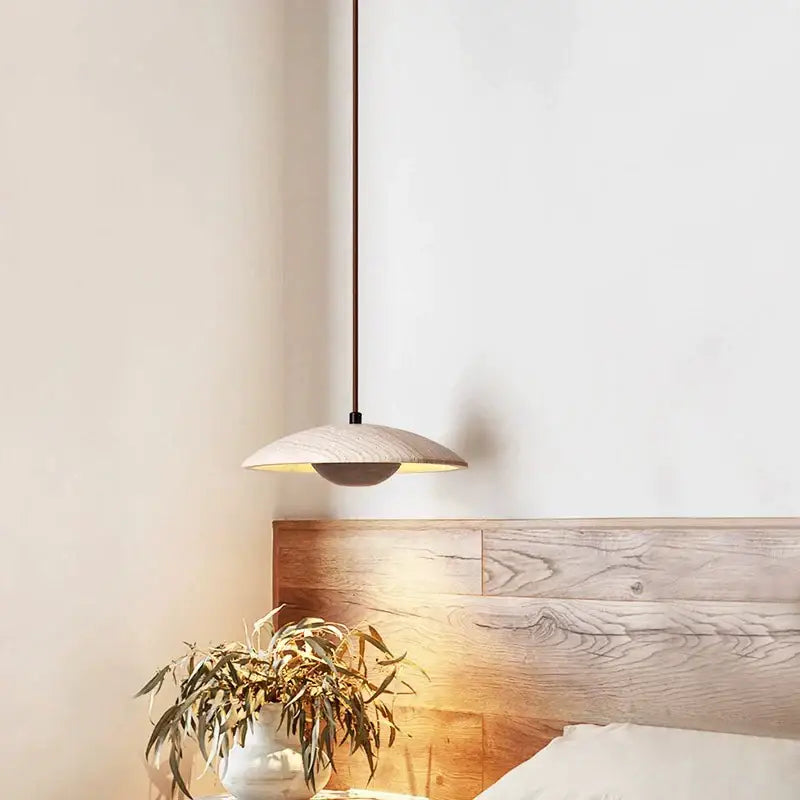 Minimalist pendant lamp with cream stone finish, light wood, and dark metal chain ideal for bedroom decorbites cream stone