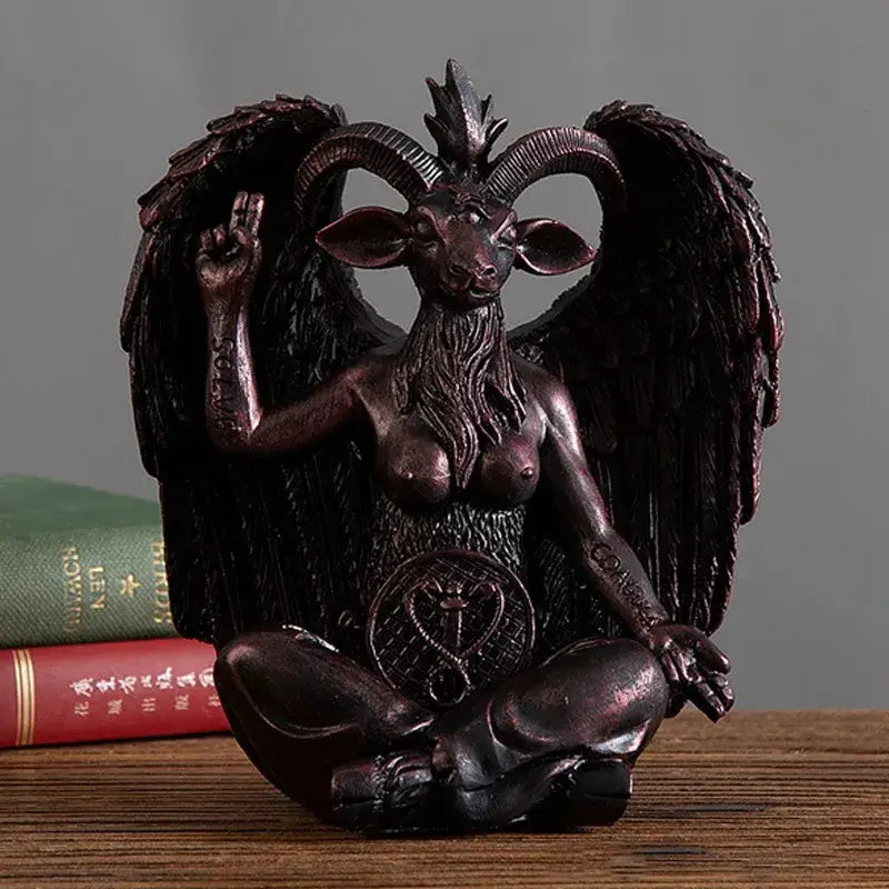 Dark bronze baphomet horned devil resin figurine with winged goat head, long beard, tattoos, and raised hand for gothic decor