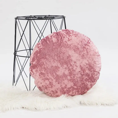 A plush round pink velvet pillow cover with a soft textured surface for decorbites dark grain living room decor