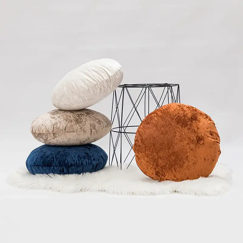 Stack of round velvet pillow covers in white beige navy blue and rust orange for decorbites dark grain living room decor