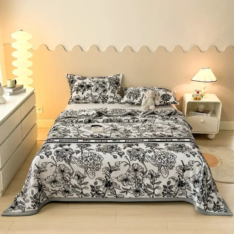 Black and white floral patterned comforter with gray trim as part of decorbites cartoon print flannel sofa cover design
