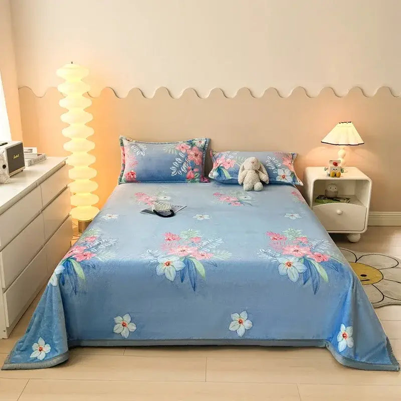 Dark gray cartoon print flannel sofa cover with blue floral-patterned bedspread featuring plush texture decorbites cartoon print