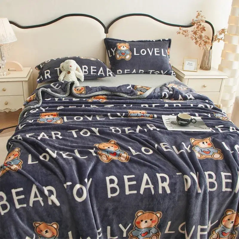 Navy blue plush blanket with embroidered teddy bears and lovely bear text complements dark gray cartoon print flannel sofa cover decorbites cartoon print