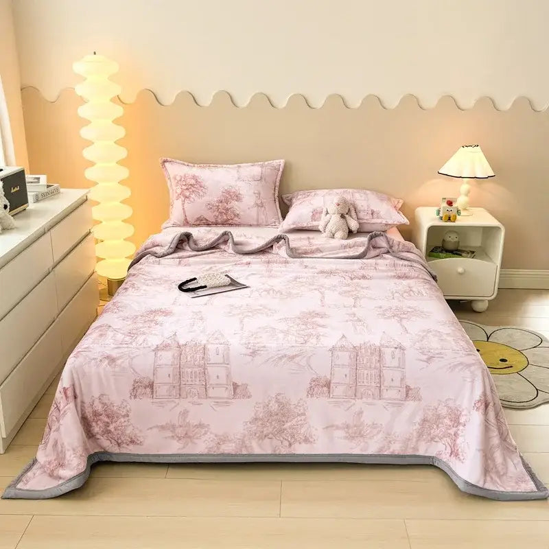 Pink quilted bedspread with vintage castle and tree pattern in muted rose tones paired with dark gray cartoon print flannel sofa cover decorbites cartoon print