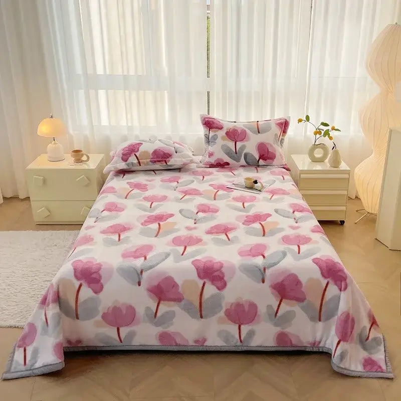 Dark gray cartoon print flannel sofa cover with pink and gray tulip-patterned fleece blanket for cozy living room decorbites cartoon print