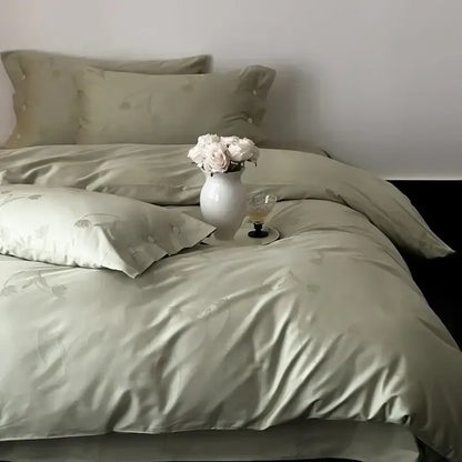Satin green bedding set with subtle floral embroidery displayed alongside dark gray egyptian cotton bedding set with floral embroidery