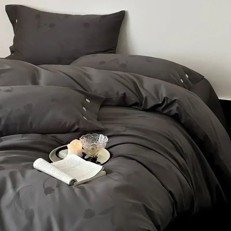 Dark gray egyptian cotton bedding set with subtle floral embroidery and button details in a satin-like finish