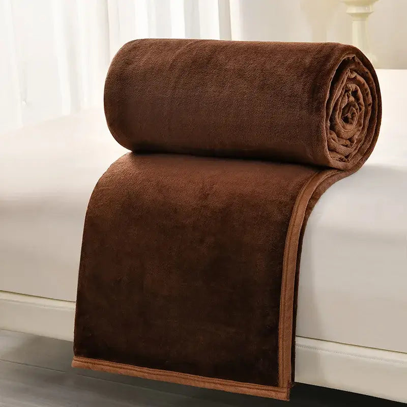 A plush chocolate brown decorbites cozy flannel blanket with velvety texture and matching border for living room decor
