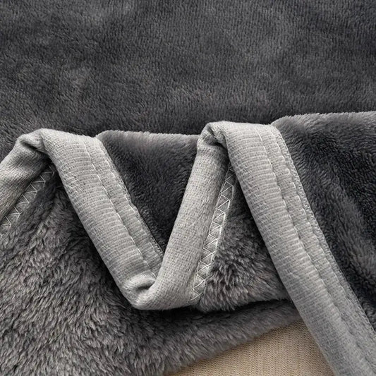 A dark gray and light gray decorbites cozy flannel blanket with soft textured fleece for living room sofa cover
