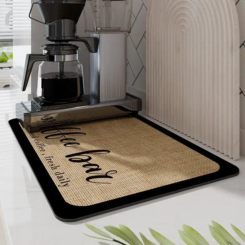 Dark gray silicone decorbites coffee mat with burlap texture black border and coffee bar script for kitchen use