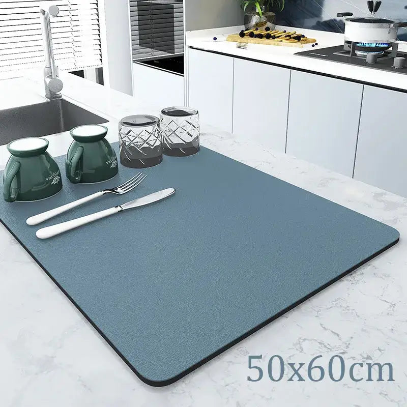 Teal rectangular silicone decorbites coffee mat with black border and textured surface for kitchen drying