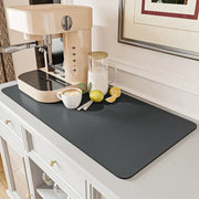 Dark gray silicone decorbites coffee mat with a smooth non-slip surface for absorbent kitchen drying use