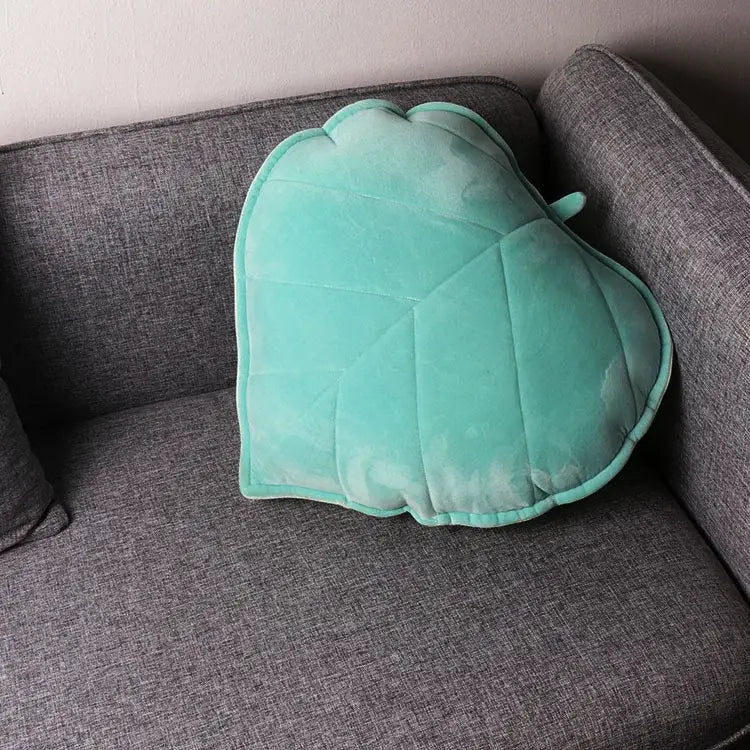 A soft mint green leaf throw pillow with quilted design and plush velvet texture from decorbites 3d leaf collection
