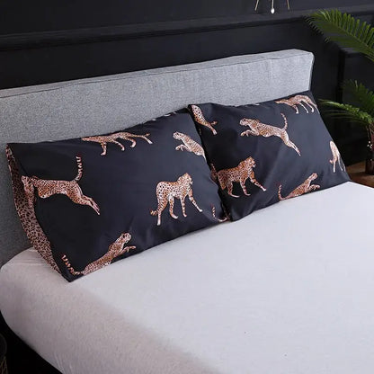 Black pillowcases with gold cheetah pattern complementing dark green floral plush duvet cover set for bedroom bedding