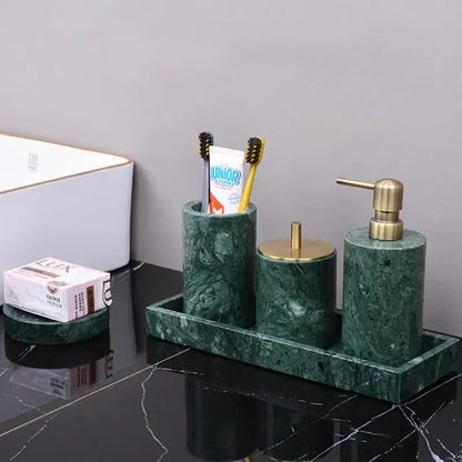Dark green marble bathroom accessory set with brass accents from decorbites featuring elegant green marble decor