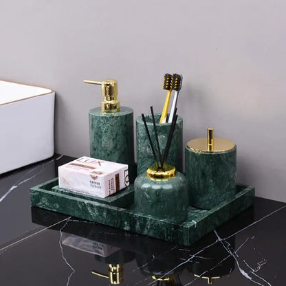 Dark green marble bathroom accessory set with gold accents from decorbites featuring green marble and metal details