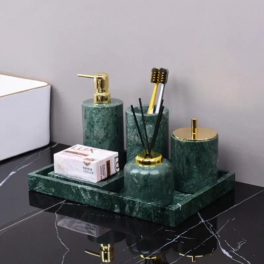 Dark green marble bathroom accessory set with gold accents from decorbites featuring green marble and metal details