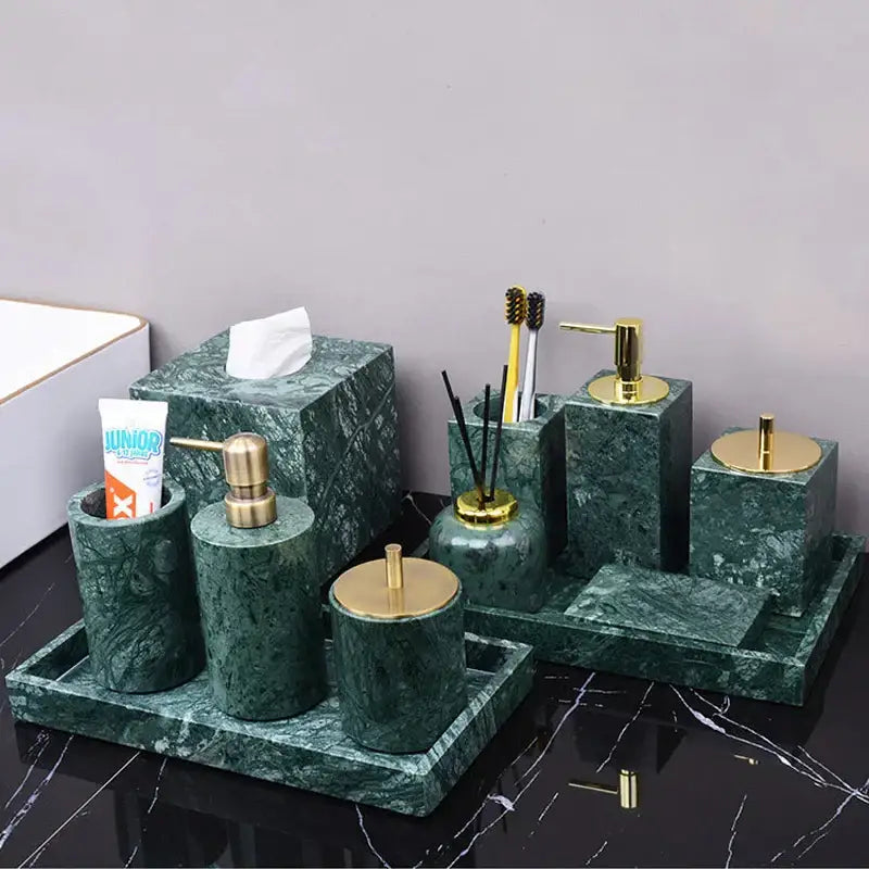 Dark green marble bathroom accessory set with gold-tone metal tops and pump mechanisms from decorbites dark green collection