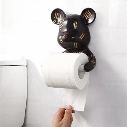 Dark green resin paper towel holder shaped like a black bear with gold roman numerals and a red nose holding white paper towel