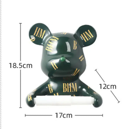 Dark green resin paper towel holder shaped like a ceramic bear with gold bh lettering and a green gemstone nose