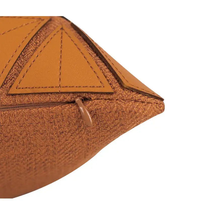 Dark orange geometric leather pillow cover with woven texture and leather accents for decorbites bedroom decor