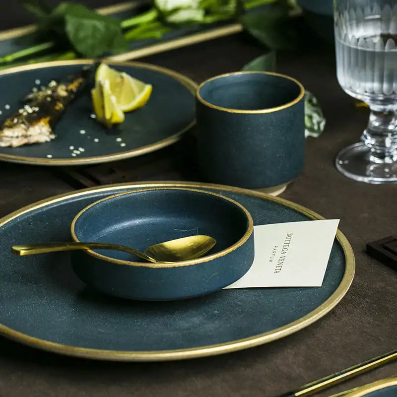 Dark teal gold rimmed ceramic western dinnerware set with matte finish and modern design for dining room use